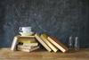 books, cup of coffee, black board, education, learning ,science concept