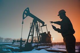 Oil drill field pumpjack silhouette 167428400 copy