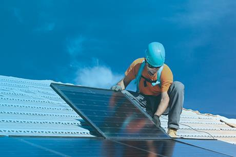 Installing alternative energy photovoltaic solar panels on roof 123739609 copy