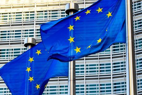EU flags in front of European Commission in Brussels