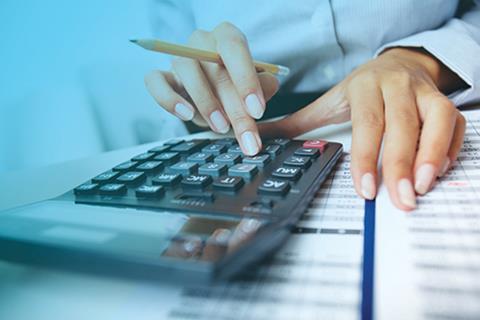 Hands holding pencil and pressing calculator 82803304 copy