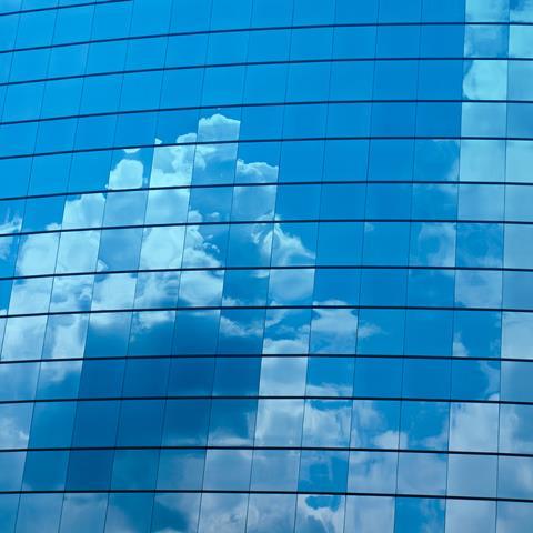 building_windows_cloud_reflections